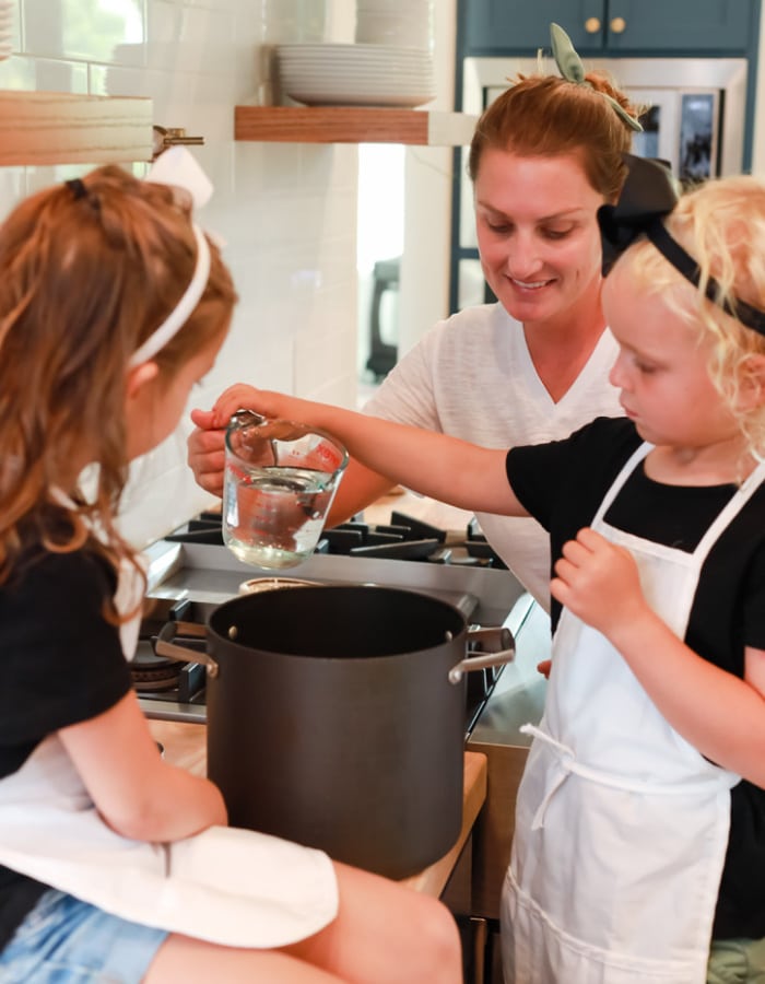 Tiffany and daughter making products in kitchen