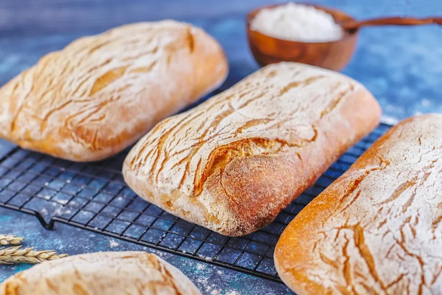 Sourdough bread loafs on blue tablecloth